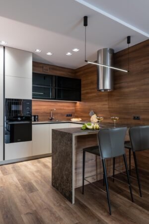 Compact Walnut Kitchen Hamburg — Full view with bar counter and stainless steel hood